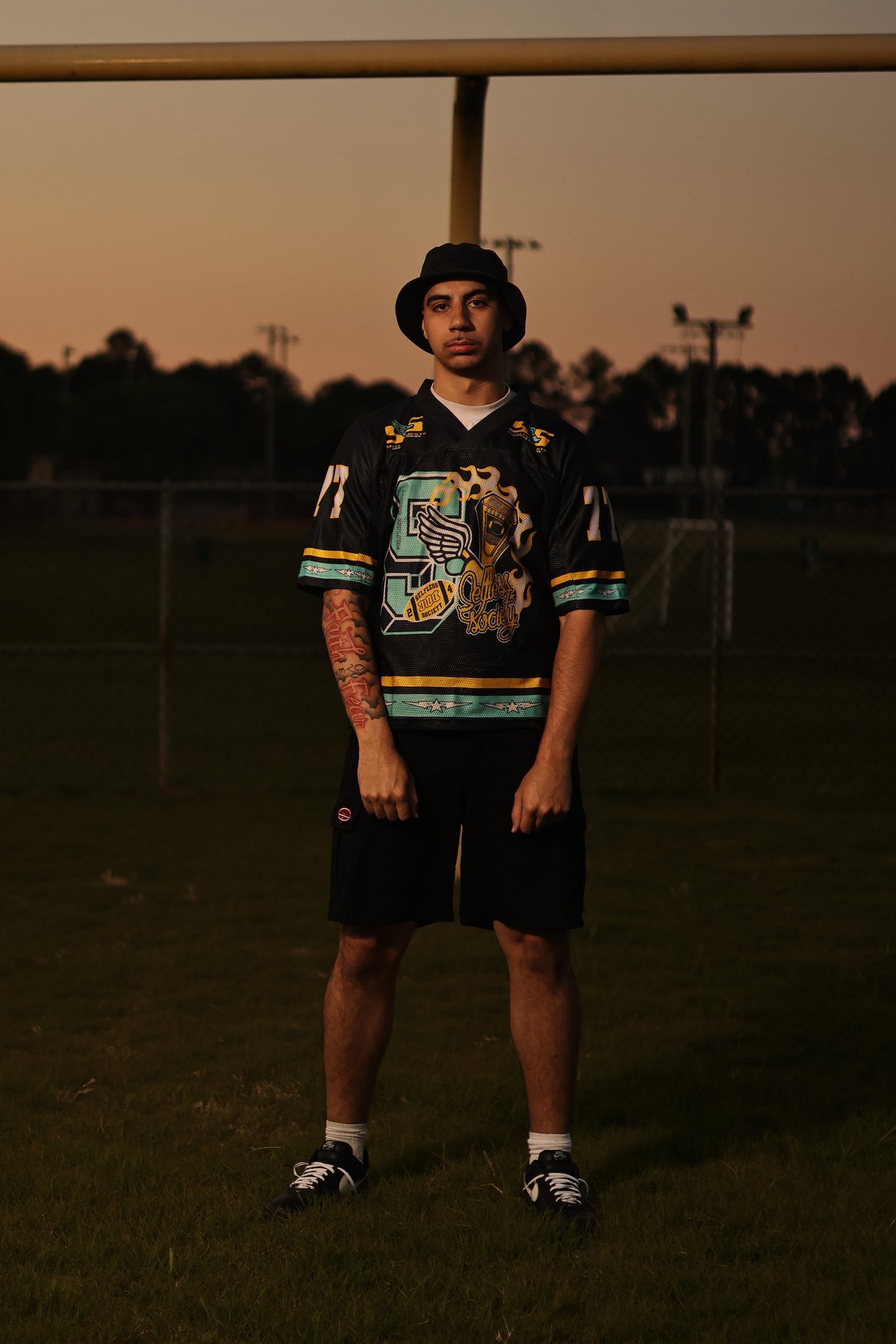 **Dark Grey and Teal “Members Only” Football**